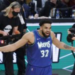 
              Minnesota Timberwolves' Karl-Anthony Towns celebrates after winning the three-point shot skills challenge competition, part of NBA All-Star basketball game weekend, Saturday, Feb. 19, 2022, in Cleveland. (AP Photo/Ron Schwane)
            