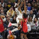 
              Utah Jazz guard Jordan Clarkson (00) goes to the basket as Houston Rockets guard Jalen Green (0) defends in the first half during an NBA basketball game Monday, Feb. 14, 2022, in Salt Lake City. (AP Photo/Rick Bowmer)
            
