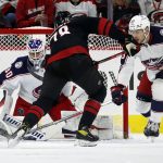 
              Carolina Hurricanes' Steven Lorentz (78) tries to shoot the puck past Columbus Blue Jackets goaltender J-F Berube (30) with Blue Jackets' Brendan Gaunce (23) nearby during the first period of an NHL hockey game in Raleigh, N.C., Friday, Feb. 25, 2022. (AP Photo/Karl B DeBlaker)
            