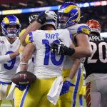 
              Los Angeles Rams wide receiver Cooper Kupp (10) is congratulated by teammates after scoring a touchdown against the Cincinnati Bengals during the second half of the NFL Super Bowl 56 football game Sunday, Feb. 13, 2022, in Inglewood, Calif. (AP Photo/Marcio Jose Sanchez)
            