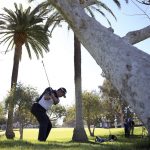 
              Hideki Matsuyama, of Japan, hits onto the 10th green from the rough during the first round of the Genesis Invitational golf tournament at Riviera Country Club, Thursday, Feb. 17, 2022, in the Pacific Palisades area of Los Angeles. (AP Photo/Ryan Kang)
            