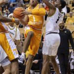 
              Tennessee's Kennedy Chandler, left, drives for a shot past Missouri's Amari Davis, right, during the first half of an NCAA college basketball game Tuesday, Feb. 22, 2022, in Columbia, Mo. (AP Photo/L.G. Patterson)
            