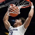 
              Xavier guard Colby Jones dunks during the first half of the team's NCAA college basketball game against Connecticut, Friday, Feb. 11, 2022, in Cincinnati. (AP Photo/Jeff Dean)
            