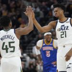 
              Utah Jazz's Donovan Mitchell (45) and Hassan Whiteside (21) high-five during the first half of the team's NBA basketball game against the Golden State Warriors on Wednesday, Feb. 9, 2022, in Salt Lake City. (AP Photo/Rick Bowmer)
            