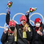 
              From left, Anna Berreiter, of Germany, Natalie Geisenberger, of Germany, and Tatyana Ivanova, of Russian Olympic Committee, celebrate at the podium for the luge women's singles at the 2022 Winter Olympics, Tuesday, Feb. 8, 2022, in the Yanqing district of Beijing. (AP Photo/Mark Schiefelbein)
            