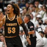 
              Wyoming's Xavier DuSell celebrates a 3-pointer against Colorado State during the first half of an NCAA college basketball game Wednesday, Feb. 23, 2022, in Fort Collins, Colo. (AAron Ontiveroz/The Denver Post via AP)
            
