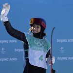 
              Eileen Gu, of China, waves after competing in the women's freestyle skiing big air finals of the 2022 Winter Olympics, Tuesday, Feb. 8, 2022, in Beijing. (AP Photo/Jae C. Hong)
            