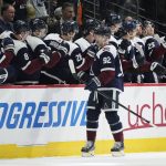 
              Colorado Avalanche left wing Gabriel Landeskog, front, is congratulated as he passes the team box after a scoring a goal against the Winnipeg Jets in the second period of an NHL hockey game Friday, Feb. 25, 2022, in Denver. (AP Photo/David Zalubowski)
            