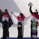 
              From left silver medal winner Australia's Scotty James, gold medal winner Japan's Ayumu Hirano and bronze medal winner Switzerland's Jan Scherrer celebrate during the venue award ceremony for the men's halfpipe finals at the 2022 Winter Olympics, Friday, Feb. 11, 2022, in Zhangjiakou, China. (AP Photo/Francisco Seco)
            