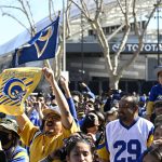 
              Fans cheer during the Los Angeles Rams' victory parade and celebration in Los Angeles, Wednesday, Feb. 16, 2022, following the Rams' win Sunday over the Cincinnati Bengals in the NFL Super Bowl 56 football game. (AP Photo/Kyusung Gong)
            