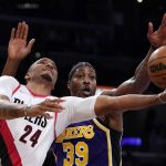 
              Portland Trail Blazers forward Norman Powell, left, shoots as Los Angeles Lakers center Dwight Howard defends during the first half of an NBA basketball game Wednesday, Feb. 2, 2022, in Los Angeles. (AP Photo/Mark J. Terrill)
            