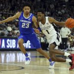 
              Providence's Al Durham (1) is defended by Creighton's Trey Alexander (23) during the first half of an NCAA college basketball game Saturday, Feb. 26, 2022, in Providence, R.I. (AP Photo/Stew Milne)
            