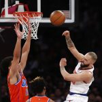 
              New York Knicks' Evan Fournier, right, passes the ball over Oklahoma City Thunder's Isaiah Roby (22) during the first half of an NBA basketball game Monday, Feb. 14, 2022, in New York. (AP Photo/John Munson)
            