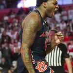 
              Auburn guard K.D. Johnson (0) reacts after a basket during the first half of an NCAA college basketball game against Georgia, Saturday, Feb. 5, 2022, in Athens, Ga. (AP Photo/John Bazemore)
            