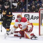 
              Vancouver Canucks' J.T. Miller (9) watches the rebound after Calgary Flames goalie Jacob Markstrom made a save during the third period of an NHL hockey game Thursday, Feb. 24, 2022, in Vancouver, British Columbia. (Darryl Dyck/The Canadian Press via AP)
            