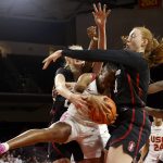 
              Southern California forward Jordan sanders, second from left, protects a rebound against Stanford forwards Cameron Brink, left, and Brooke Demetre, second from right, in the first half of an NCAA college basketball game Sunday, Feb. 6, 2022, in Los Angeles. (AP Photo/Ringo H.W. Chiu)
            
