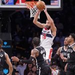 
              Washington Wizards forward Anthony Gill (16) passes the ball off a rebound in the second half of an NBA basketball game against the Brooklyn Nets, Thursday, Feb. 17, 2022, in New York. (AP Photo/John Minchillo)
            