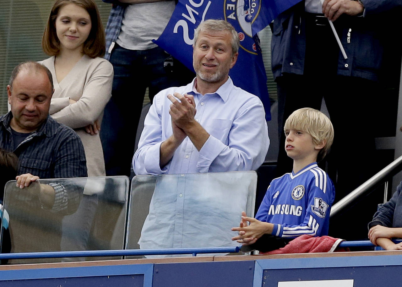 FILE - Chelsea's owner Roman Abramovich, center, applauds after Chelsea were presented with the Pre...