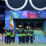 
              Elsa Desmond and Brendan Newby, of Ireland, carry their national flag into the stadium during the opening ceremony of the 2022 Winter Olympics, Friday, Feb. 4, 2022, in Beijing. (AP Photo/Jae C. Hong)
            