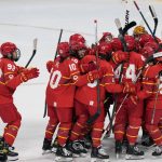 
              China players celebrate after defeating Japan in a shoot-out during a preliminary round women's hockey game at the 2022 Winter Olympics, Sunday, Feb. 6, 2022, in Beijing. (AP Photo/Petr David Josek)
            