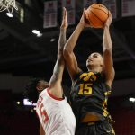 
              Iowa forward Keegan Murray (15) goes to the basket against Maryland guard Eric Ayala (5) during the first half of an NCAA college basketball game, Thursday, Feb. 10, 2022, in College Park, Md. (AP Photo/Nick Wass)
            