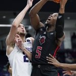 
              Rutgers forward Aundre Hyatt, right, shoots against Northwestern forward Pete Nance during the first half of an NCAA college basketball game in Evanston, Ill., Tuesday, Feb. 1, 2022. (AP Photo/Nam Y. Huh)
            