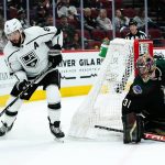 
              Los Angeles Kings defenseman Drew Doughty (8) skates with the puck as Arizona Coyotes goaltender Scott Wedgewood (31) watches during the second period of an NHL hockey game Wednesday, Feb. 23, 2022, in Glendale, Ariz. (AP Photo/Ross D. Franklin)
            