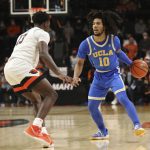 
              Oregon State guard Dashawn Davis (13) guards against UCLA guard Tyger Campbell (10) during the second half of an NCAA college basketball game on Saturday, Feb. 26, 2022, in Corvallis, Ore. UCLA won 94-55. (AP Photo/Amanda Loman)
            