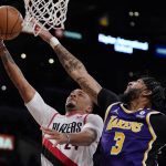 
              Portland Trail Blazers forward Norman Powell, left, shoots as Los Angeles Lakers forward Anthony Davis defends during the second half of an NBA basketball game Wednesday, Feb. 2, 2022, in Los Angeles. (AP Photo/Mark J. Terrill)
            