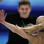 
              Alexa Knierim and Brandon Frazier, of the United States, compete in the pairs short program during the figure skating competition at the 2022 Winter Olympics, Friday, Feb. 18, 2022, in Beijing. (AP Photo/Natacha Pisarenko)
            