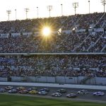 
              The sun sets as cars run during the NASCAR Daytona 500 auto race Sunday, Feb. 20, 2022, at Daytona International Speedway in Daytona Beach, Fla. (AP Photo/Chris O'Meara)
            