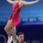
              Anastasia Mishina and Aleksandr Galliamov, of the Russian Olympic Committee, compete in the pairs short program during the figure skating competition at the 2022 Winter Olympics, Friday, Feb. 18, 2022, in Beijing. (AP Photo/Bernat Armangue)
            