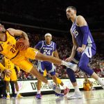 
              Iowa State guard Gabe Kalscheur (22) is fouled by Kansas State forward Ismael Massoud (25) during the first half of an NCAA college basketball game, Saturday, Feb. 12, 2022, in Ames, Iowa. (AP Photo/Charlie Neibergall)
            