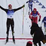 
              Victoria Carl, of Germany, celebrates a gold medal finish ahead of silver medal finisher Jonna Sundling, of Sweden, right, and bronze medal finisher Natalia Nepryaeva, of the Russian Olympic Committee, during the women's team sprint classic cross-country skiing competition at the 2022 Winter Olympics, Wednesday, Feb. 16, 2022, in Zhangjiakou, China. (AP Photo/Alessandra Tarantino)
            
