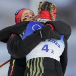 
              Victoria Carl, of Germany, right and Katharina Hennig celebrate a gold medal finish during the women's team sprint classic cross-country skiing competition at the 2022 Winter Olympics, Wednesday, Feb. 16, 2022, in Zhangjiakou, China. (AP Photo/Aaron Favila)
            