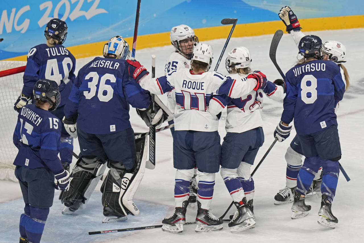 United States' Amanda Kessel (28) is congratulated by Alex Carpenter (25) and Abby Roque (11) after...