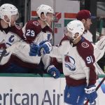 
              Colorado Avalanche center Nazem Kadri (91) celebrates his goal with teammate Gabriel Landeskog (92) during the first period of an NHL hockey game against the Dallas Stars in Dallas, Sunday, Feb. 13, 2022. (AP Photo/LM Otero)
            