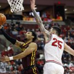 
              Minnesota's Payton Willis, left, shoots past Ohio State's Kyle Young during the first half of an NCAA college basketball game Tuesday, Feb. 15, 2022, in Columbus, Ohio. (AP Photo/Jay LaPrete)
            