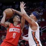 
              Houston Rockets guard Jalen Green (0) looks to shoot against New Orleans Pelicans guard Josh Hart, right, during the first half of an NBA basketball game Sunday, Feb. 6, 2022, in Houston. (AP Photo/Michael Wyke)
            