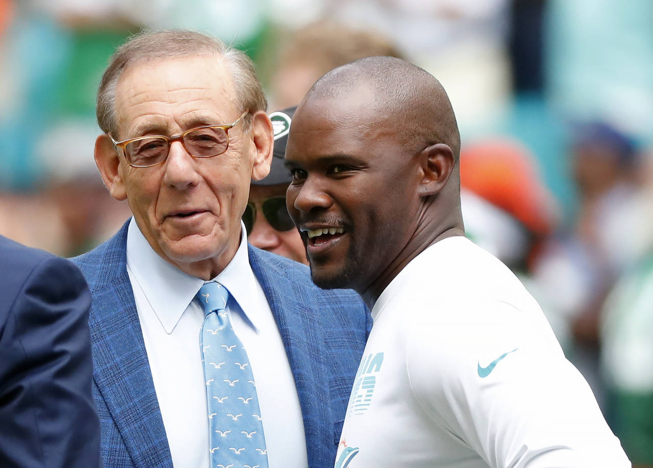 FILE -Miami Dolphins head coach Brian Flores talks to Miami Dolphins owner Stephen M. Ross during p...