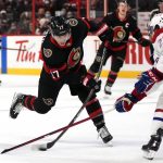 
              Ottawa Senators center Adam Gaudette (17) winds up for a shot in front of Montreal Canadiens defenseman Alexander Romanov (27) during the second period of an NHL hockey game Saturday, Feb. 26, 2022 in Ottawa, Ontario. (Justin Tang/The Canadian Press via AP)
            