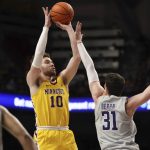 
              Minnesota forward Jamison Battle (10) shoots the ball over Northwestern forward Robbie Beran (31) during the first half of an NCAA college basketball game Saturday, Feb. 19, 2022, in Minneapolis. (AP Photo/Stacy Bengs)
            