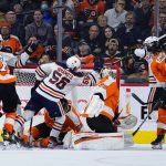 
              Edmonton Oilers' Kailer Yamamoto (56) celebrates after scoring a goal against Philadelphia Flyers' Carter Hart (79) during the second period of an NHL hockey game, Tuesday, March 1, 2022, in Philadelphia. (AP Photo/Matt Slocum)
            