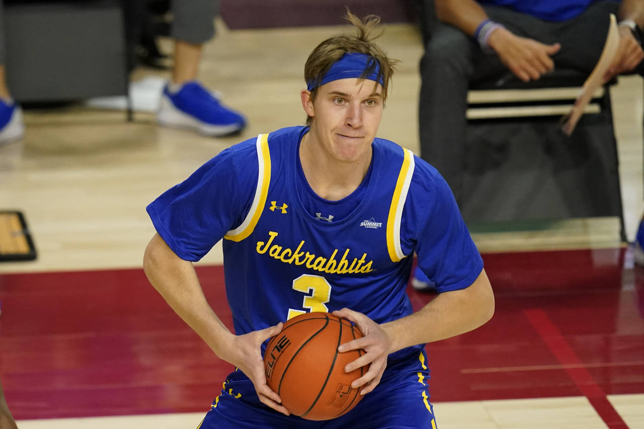 FILE - South Dakota State guard Baylor Scheierman looks to pass during the second half of an NCAA c...