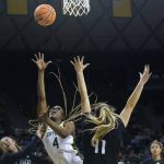 
              Baylor center Queen Egbo (4) shoots against Hawaii forward Kallin Spiller (11) and guard Kelsie Imai during the first half of a college basketball game in the first round of the NCAA tournament in Waco, Texas, Friday, March 18, 2022. (AP Photo/LM Otero)
            