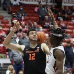 
              Oregon State center Roman Silva, left, and Washington State forward Efe Abogidi are unable to come up with the ball during the second half of an NCAA college basketball game Thursday, March 3, 2022, in Pullman, Wash. Washington State won 71-67. (AP Photo/Young Kwak)
            