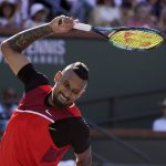 
              Nick Kyrgios, of Australia, tosses his racket after losing a point to Rafael Nadal, of Spain, during a quarterfinal in the BNP Paribas Open tennis tournament Thursday, March 17, 2022, in Indian Wells, Calif. (AP Photo/Mark J. Terrill)
            