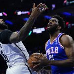 
              Philadelphia 76ers' Joel Embiid, right, tries to get a shot past Brooklyn Nets' Andre Drummond during the first half of an NBA basketball game, Thursday, March 10, 2022, in Philadelphia. (AP Photo/Matt Slocum)
            