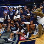 
              Villanova players pose with the tournament trophy after defeating Creighton in the final of the Big East conference tournament Saturday, March 12, 2022, in New York.  (AP Photo/Frank Franklin II)
            