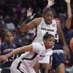 
              South Carolina forward Aliyah Boston, top, and guard Zia Cooke, bottom, look at a loose ball during the first half of a first round game against Howard in the NCAA women's college basketball tournament Friday, March 18, 2022 in Columbia, S.C. (AP Photo/Sean Rayford)
            